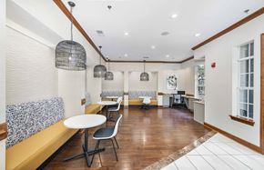 Atlanta apartment for rent - a dining room with tables and chairs and a large window