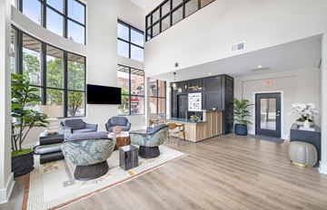 Charlotte apartment for rent - a living room with couches and chairs and a tv