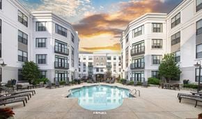 Charlotte apartment for rent - a swimming pool in the middle of some tall buildings