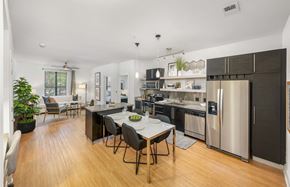 Charlotte apartment for rent - a kitchen with stainless steel appliances and a dining table