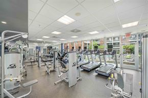 Charlotte apartment for rent - a gym with a lot of cardio equipment and weights
