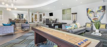 Charlotte apartment for rent - a living room with a pool table and a large painting on the wall