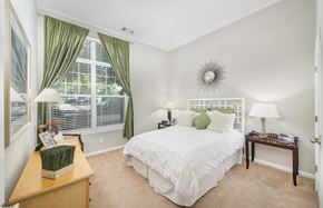 Rockville apartment for rent - a bedroom with a bed and a large window