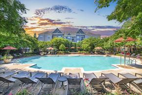 Rockville apartment for rent - a swimming pool with chairs and umbrellas and a resort style pool