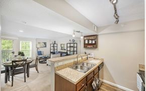 Mclean apartment for rent - A kitchen with a sink and a dining table.
