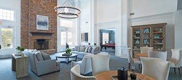 Charlotte apartment for rent - a living room with couches and chairs and a fireplace