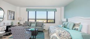 Orlando apartment for rent - a bedroom with a bed and a couch and a window