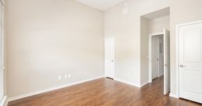 Orlando apartment for rent - an empty bedroom with wood flooring and white walls