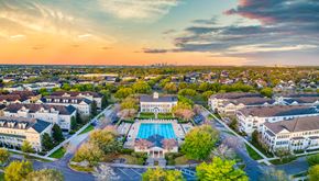 Orlando apartment for rent - an aerial view of a neighborhood with a swimming pool and buildings