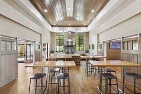 Windermere apartment for rent - a large kitchen with wood floors and tables and chairs
