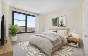 Alexandria apartment for rent - a bedroom with a large window and a bed