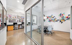 Alexandria apartment for rent - a conference room with a table and chairs and a glass door