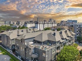 Dallas apartment for rent - an aerial view of an apartment building with a city in the background