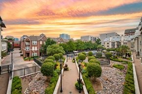 Dallas apartment for rent - an aerial view of a city park with buildings and a sunset