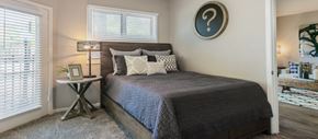 Dallas apartment for rent - a bedroom with a bed and a window