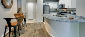 Dallas apartment for rent - a kitchen with a bar and a counter top in a house