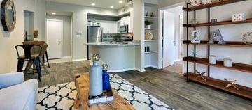 Dallas apartment for rent - a living room with a kitchen and a table