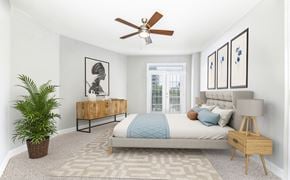 Dallas apartment for rent - a bedroom with a bed and a ceiling fan