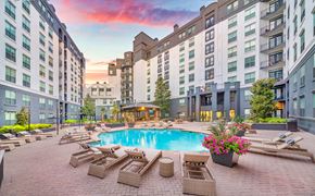 Dallas apartment for rent - a swimming pool in the middle of an apartment building