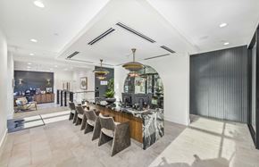 Dallas apartment for rent - a dining room with a long table and chairs in front of a kitchen