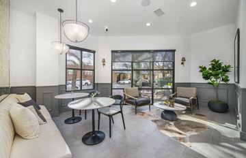 Dallas apartment for rent - a living room with a couch and chairs and a large window