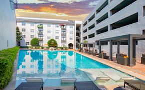 Addison apartment for rent - a swimming pool in front of an apartment building