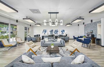 Houston apartment for rent - a living room with couches and chairs and a table
