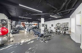 Plano apartment for rent - the gym is equipped with cardio machines and weights
