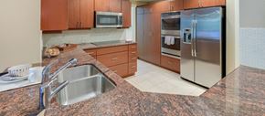 Dallas apartment for rent - a kitchen with granite counter tops and stainless steel appliances