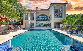 Austin apartment for rent - a large swimming pool in front of a house
