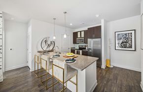 Austin apartment for rent - A kitchen with a table and chairs in the middle of the room.