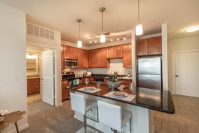 Austin apartment for rent - a kitchen with granite counter tops and stainless steel appliances