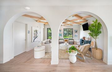 Tampa apartment for rent - a living room with white walls and white furniture and archways