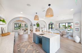 Tampa apartment for rent - a kitchen with a blue island in the middle of a living room
