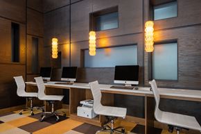 Tampa apartment for rent - a conference room with four computer desks and chairs