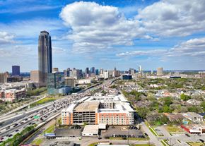 Houston apartment for rent - an aerial view of the city with highways and a tall building