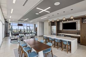Atlanta apartment for rent - A modern dining room with a large table and chairs.