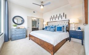 Atlanta apartment for rent - a bedroom with a large bed and a ceiling fan