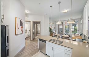 Denver apartment for rent - an open kitchen and living room with a view of the living room and dining room