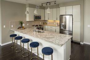 St. Louis Park apartment for rent - a kitchen with a marble counter top and stainless steel appliances