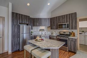 Sun Prairie apartment for rent - a kitchen with stainless steel appliances and a marble counter top