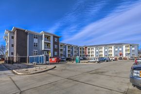 Sun Prairie apartment for rent - an empty parking lot in front of an apartment building