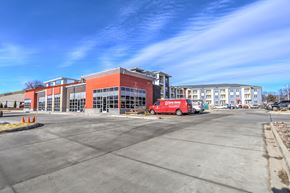 Sun Prairie apartment for rent - a red building with a red truck in front of it