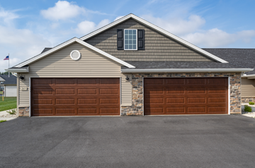 Findlay apartment for rent - A two-car garage is attached to a house.