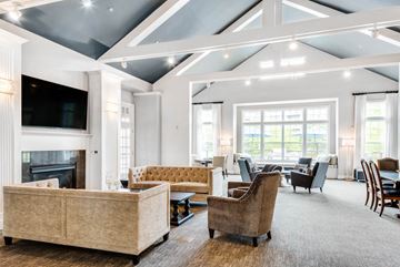 Burlington apartment for rent - a large living room with couches and chairs and a fireplace