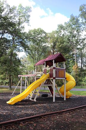 East Stroudsburg apartment for rent - a playground with a swing set and a slide