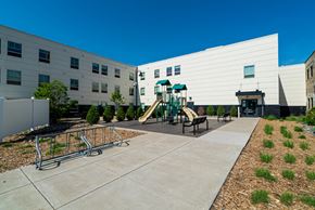 St Paul apartment for rent - the childrens play area in therium of a building with playground equipment