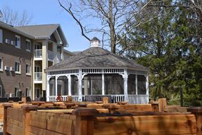 Coralville apartment for rent - a gazebo in the middle of a yard with wooden fence