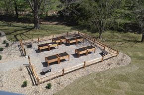 Coralville apartment for rent - a gathering area with benches and tables in a park