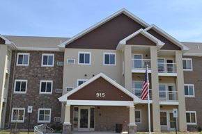 Coralville apartment for rent - a building with an flag in front of it